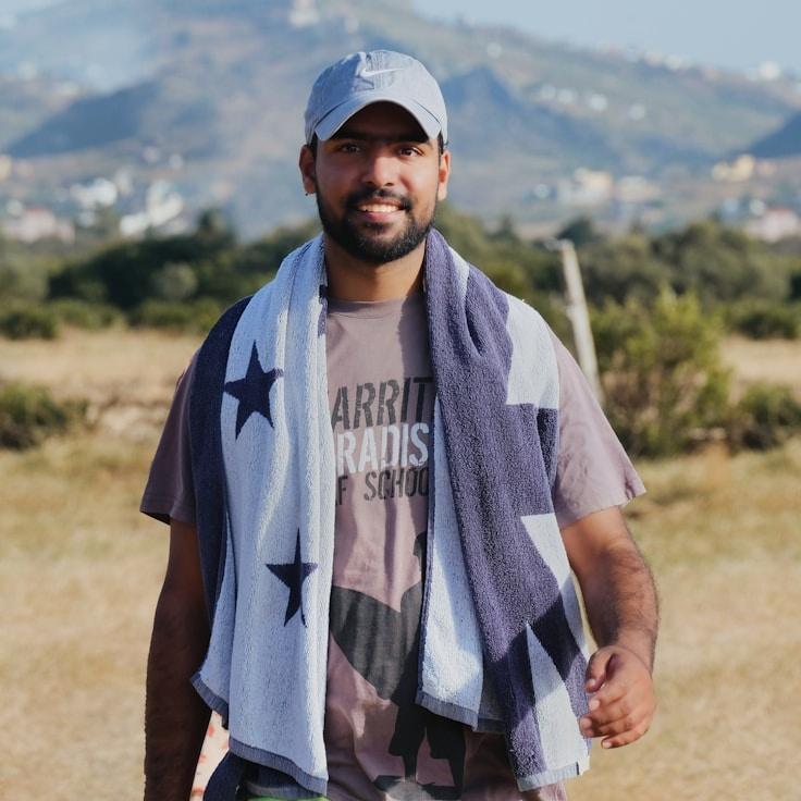 Alex Chen, Lead Design Curator at GardenPlumeOak, reviewing corporate floral arrangements